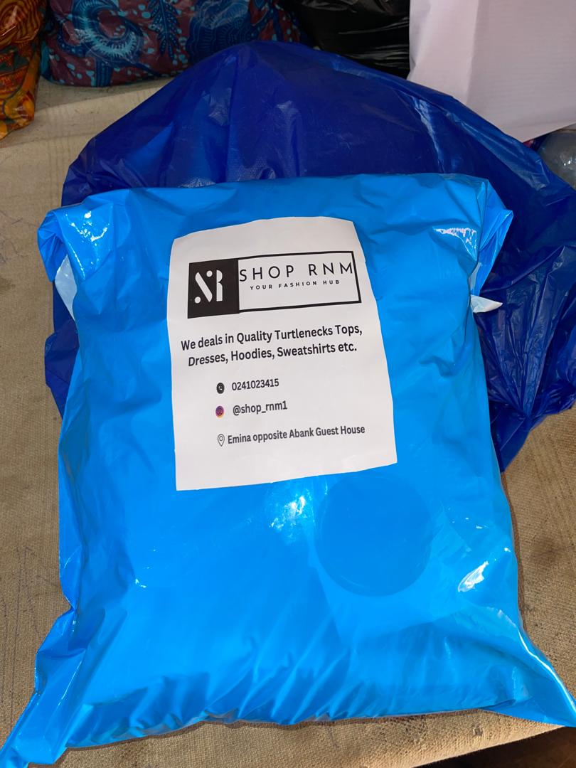 A blue SHOP RNM parcel packed for customer delivery